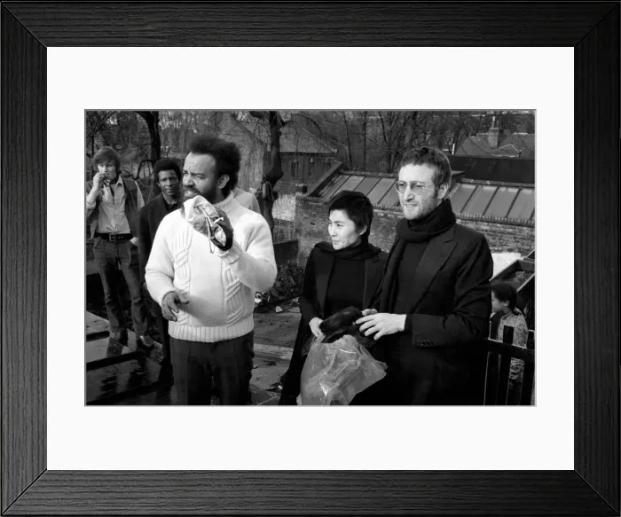 Framed Print : John Lennon and Yoko pictured on the roof of Black House in Holloway Road, with Michael X Framed Print : John Lennon and Yoko pictured on the roof of Black House in Holloway Road, with Michael X