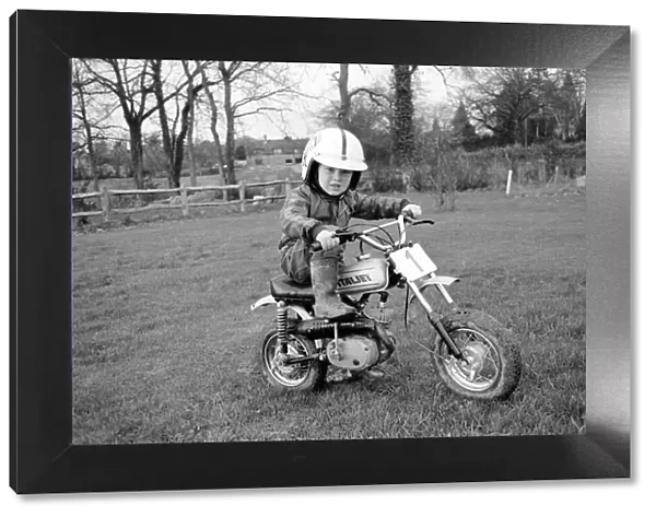 4 years old Jan Dixon on his mino motor bike. December 1974 74-7664-008