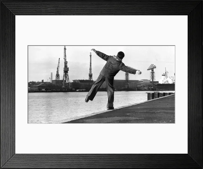 Framed Print : A young boy plays along the banks of the River Tyne Framed Print : A young boy plays along the banks of the River Tyne