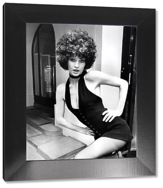 British model Vicki Hodge wearing little black shorts dress by Jean Patou. Note The J. P
