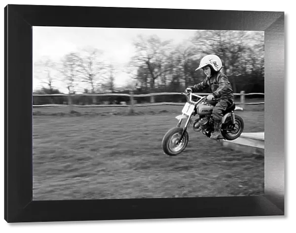 4 years old Jan Dixon on his mino motor bike. December 1974 74-7664-009
