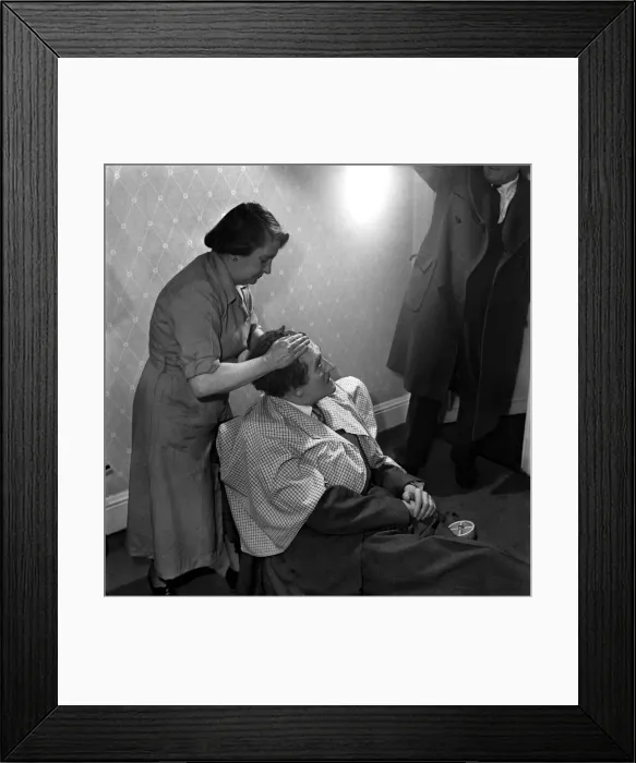 Framed Print : Hair restoration expert seen here giving a consultation. D7584-001 Framed Print : Hair restoration expert seen here giving a consultation. D7584-001