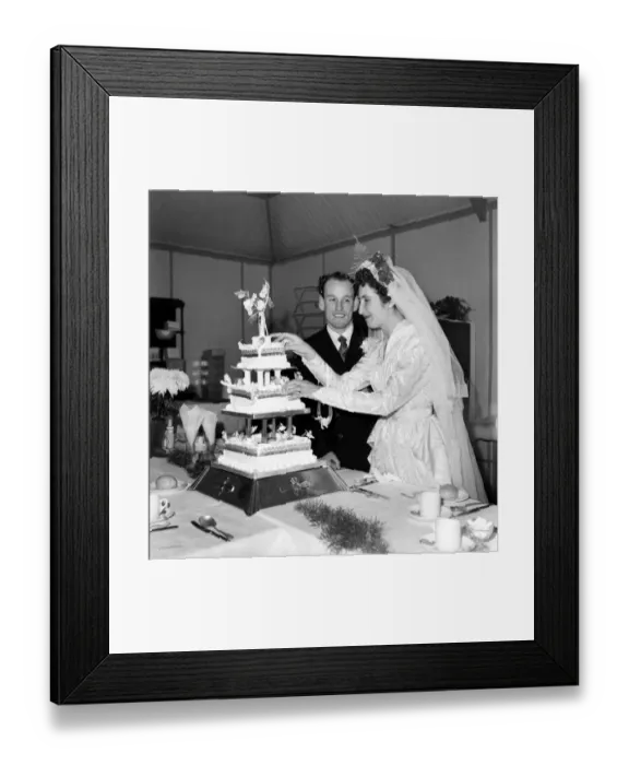 Framed Print : The bride and groom cut the cake. October 1953 D6213 Framed Print : The bride and groom cut the cake. October 1953 D6213