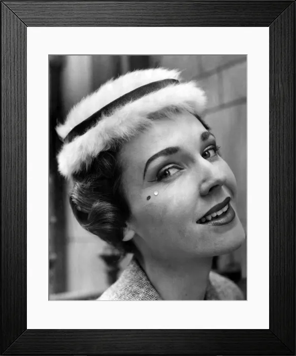 Framed Print : Model seen here wearing the latest millinery and beauty spots. July 1955 P010000 Framed Print : Model seen here wearing the latest millinery and beauty spots. July 1955 P010000