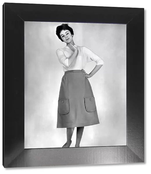 Reveille fashions: Jackie Jackson modelling a pocketed skirt. September 1960 P008989