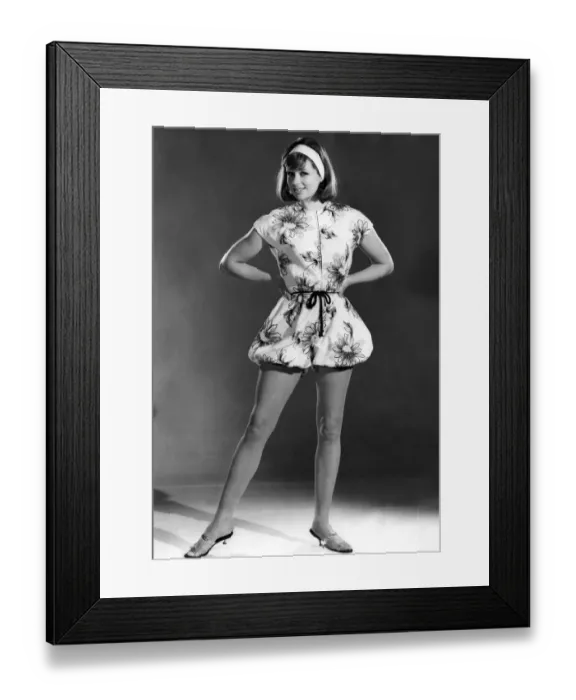 Framed Print : Reveille fashions 1962: Annie Alliston wearing a floral print beach wear outfit