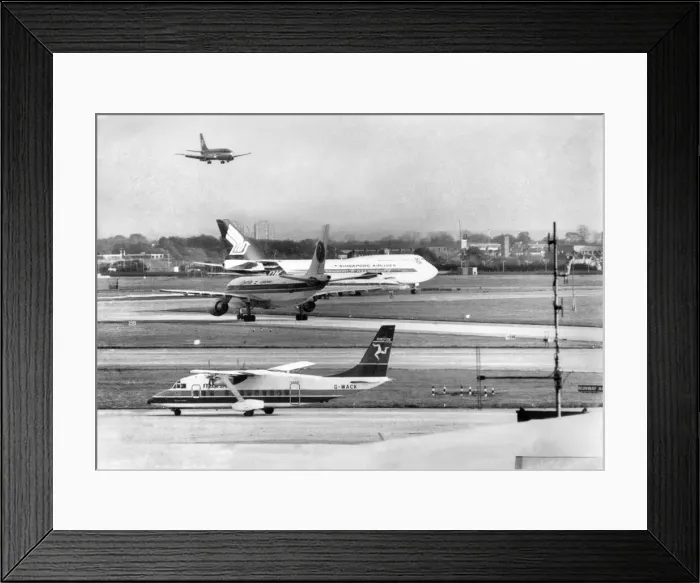 Framed Print : Aircraft coming and going at Londons Heathrow Airport. November 1986 P004352 Framed Print : Aircraft coming and going at Londons Heathrow Airport. November 1986 P004352