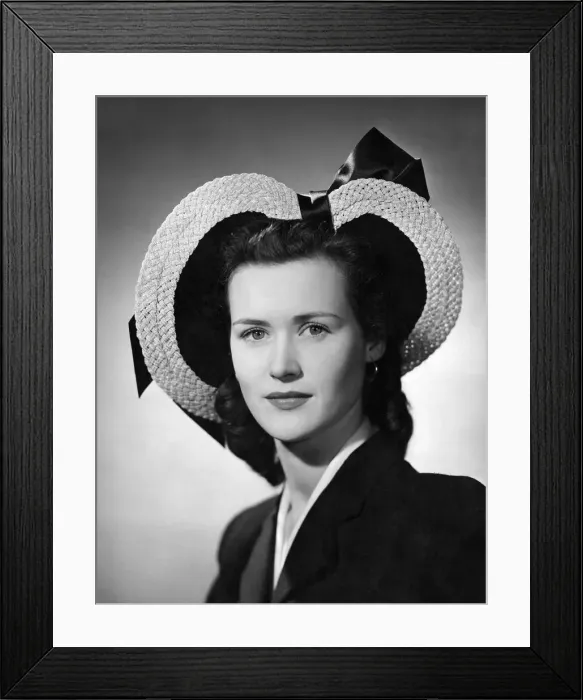 Framed Print : A striking halo hat by Jay, natural plaited straw giving heart effect with large satin