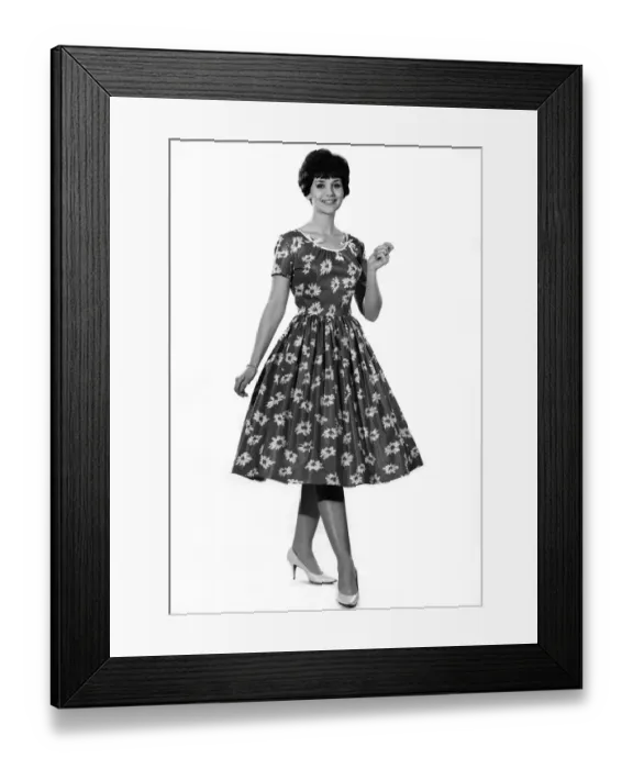 Framed Print : Reveille fashions: Ann Cave modelling a flower print summer dress. July 1961 P008773 Framed Print : Reveille fashions: Ann Cave modelling a flower print summer dress. July 1961 P008773