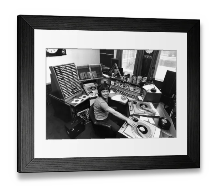 Framed Print : Radio I disc-jockey Tony Blackburn at the studio console equipped with all the tricks of