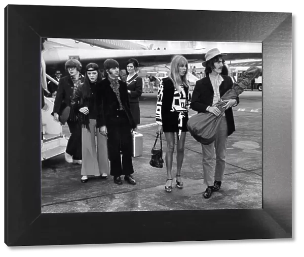 Ringo Starr with wife Maureen, and George Harrison with wife Pattie at Heathrow