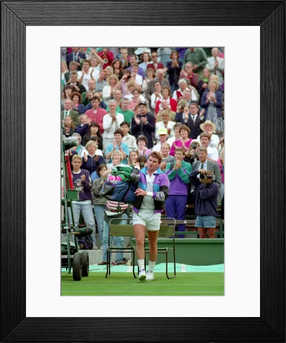 Framed Print : All England Lawn Tennis Championships at Wimbledon. Jimmy Connors leaves the court to