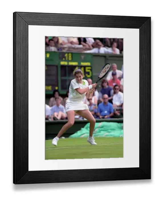 Framed Print : All England Lawn Tennis Championships at Wimbledon. Monica Seles in action during