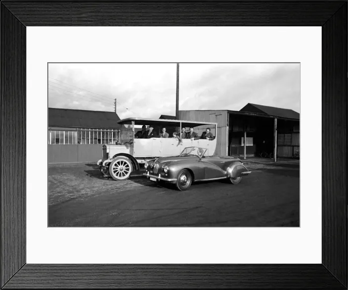 Framed Print : Mrs. W. A. Hudson seen here passing a vintage coach in her new sports car Framed Print : Mrs. W. A. Hudson seen here passing a vintage coach in her new sports car