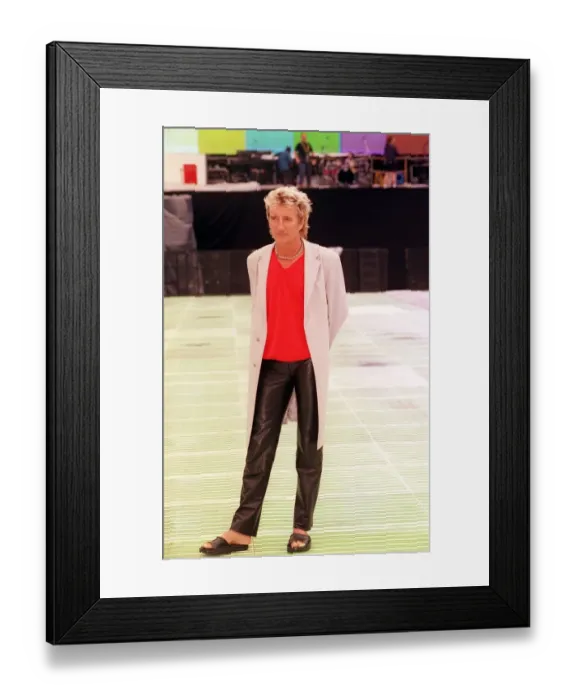 Framed Print : Rod Stewart Hampden photocall July 1999 wearing black leather trousers red v necked