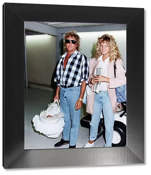 Rod Stewart and Wife Rachel leaves Heathrow Airport Aug 1992