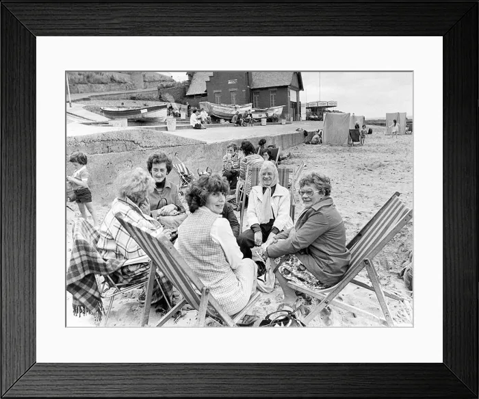 Framed Print : It was so windy at Whitley Bay in August, 1977, that these holidaymakers had to keep Framed Print : It was so windy at Whitley Bay in August, 1977, that these holidaymakers had to keep