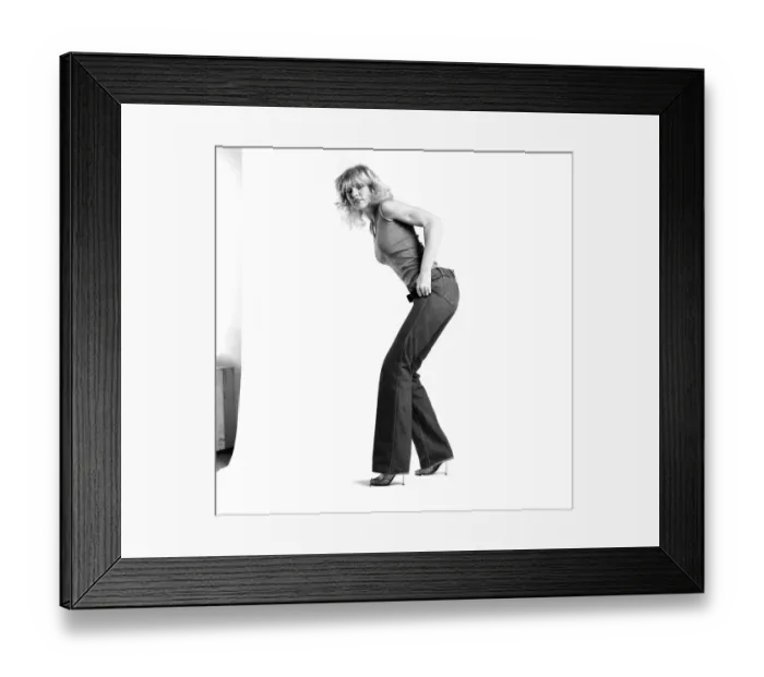 Framed Print : Fashion: Clothing: A woman pulling up a pair of denim jeans. January 1981 81-00051-006 Framed Print : Fashion: Clothing: A woman pulling up a pair of denim jeans. January 1981 81-00051-006