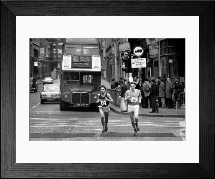 Framed Print : New Years Day Races in the City of London January 1975. Runners with double Framed Print : New Years Day Races in the City of London January 1975. Runners with double