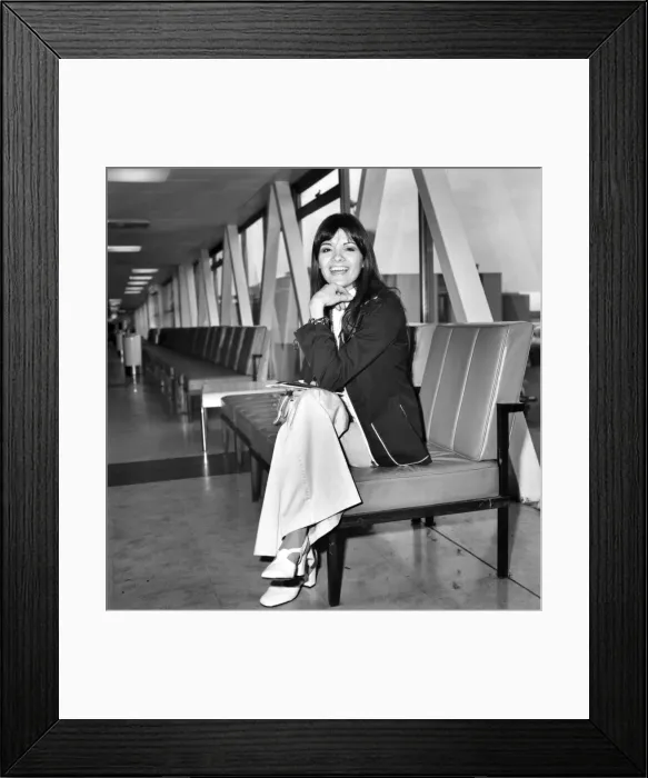 Framed Print : Pop singer Eve Graham. Singer Eve Graham left Heathrow Airport today for Los Angeles