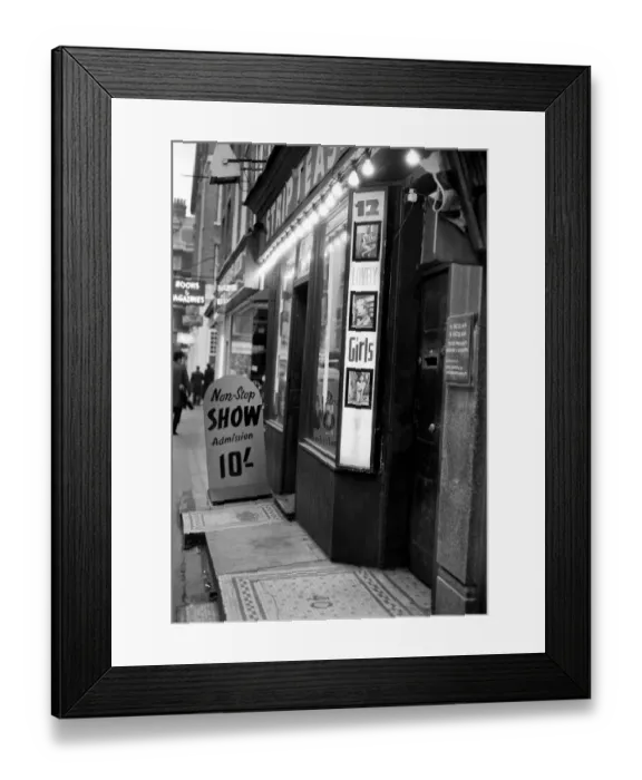 Framed Print : Strip clubs and book shops in Soho. December 1970 70-11636