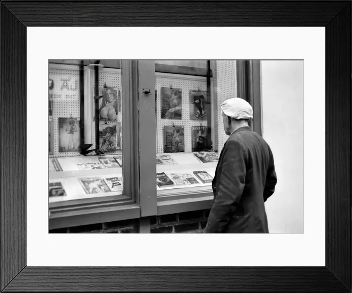 Framed Print : Man loooking in a book shop window in Soho. December 1970 70-11636-004 Framed Print : Man loooking in a book shop window in Soho. December 1970 70-11636-004