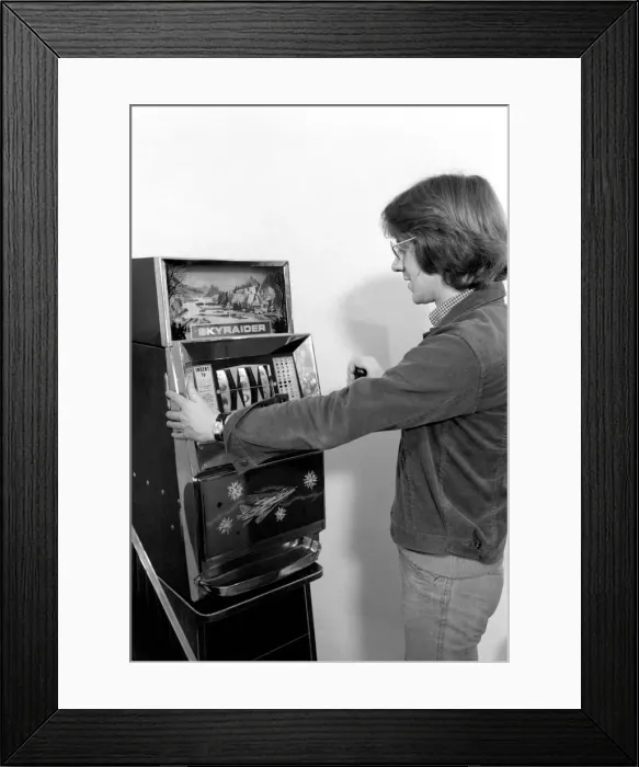 Framed Print : Fruit machines / Arcades / Amusements / Gambling. January 1975 75-00158-001 Framed Print : Fruit machines / Arcades / Amusements / Gambling. January 1975 75-00158-001