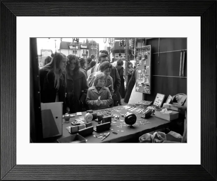 Framed Print : Last of the big spenders at Petticoat Lane. The moment of decision for 8-year-old Deborah