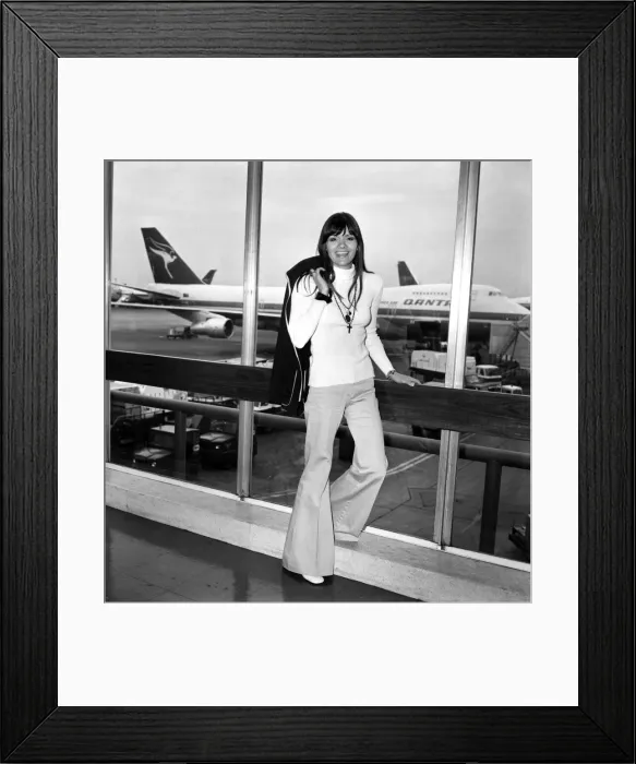 Framed Print : Pop singer Eve Graham. Singer Eve Graham left Heathrow Airport today for Los Angeles