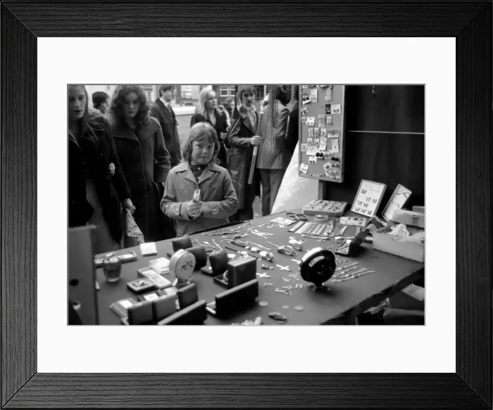 Framed Print : Last of the big spenders at Petticoat Lane. The moment of decision for 8-year-old Deborah