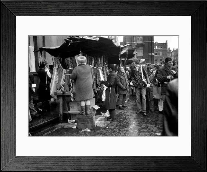 Framed Print : Last of the big spenders at Petticoat Lane. This lady stall holder uses a box to keep up