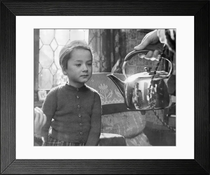 Framed Print : A young girl learns about the dangers of boiling water and kettles Framed Print : A young girl learns about the dangers of boiling water and kettles