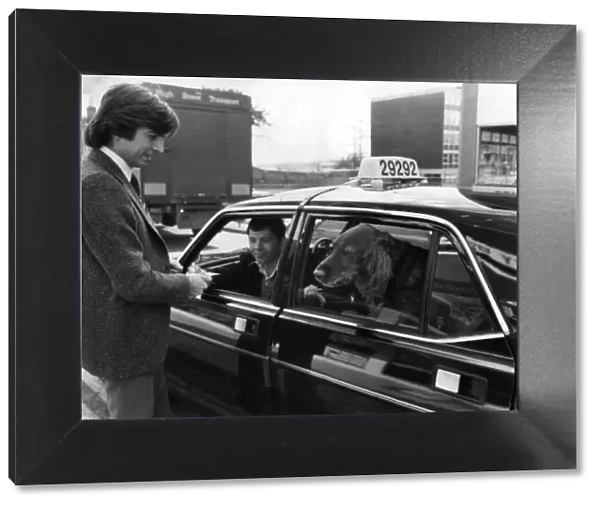 John Carter-Griffiths pays the cabbie Nigel Balcombe for Sammy the Setter