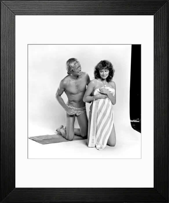 Framed Print : Models pose as a shy couple in the studio August 1977 77-04388-004 Framed Print : Models pose as a shy couple in the studio August 1977 77-04388-004