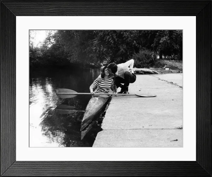Framed Print : Ray Haynes kisses his wife Janice goodbye as she sets off to paddle to work from Windsor Framed Print : Ray Haynes kisses his wife Janice goodbye as she sets off to paddle to work from Windsor