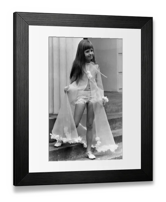 Framed Print : Six-year-old Yasmin Pennial models a see-through negligee Framed Print : Six-year-old Yasmin Pennial models a see-through negligee