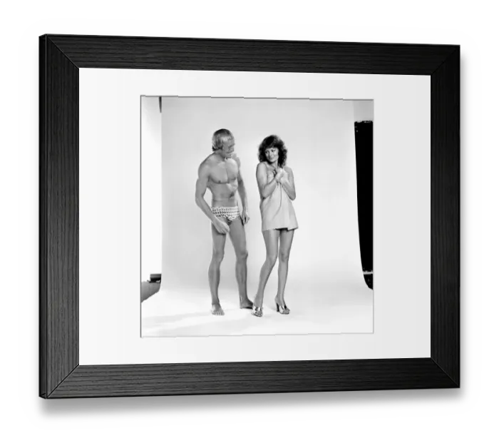 Framed Print : Models pose as a shy couple in the studio August 1977 77-04388-005 Framed Print : Models pose as a shy couple in the studio August 1977 77-04388-005