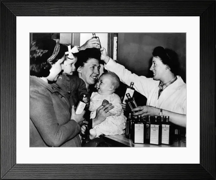 Framed Print : Distribution of cod liver oil and orange juice to mothers Framed Print : Distribution of cod liver oil and orange juice to mothers