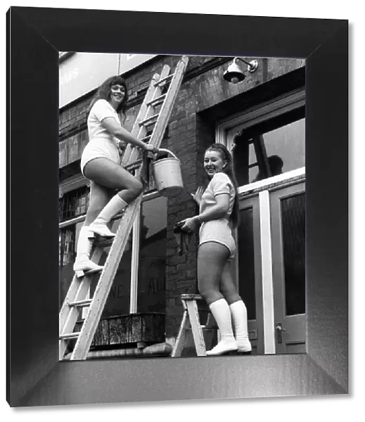 Sandra Stokes gets to work window cleaning on the high ladder while her partner