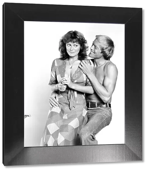 Models pose as a shy couple in the studio August 1977 77-04388-006