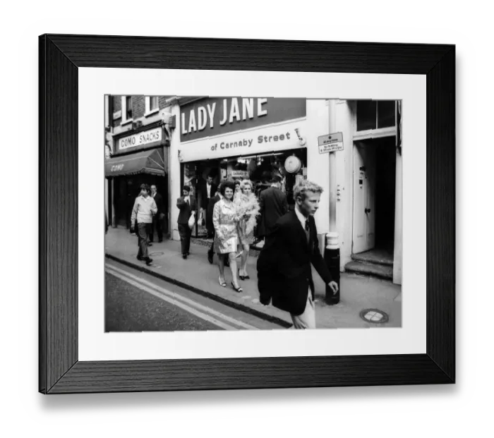 Framed Print : The girls after they had selected their mini-skirts. September 1967 P006385 Framed Print : The girls after they had selected their mini-skirts. September 1967 P006385