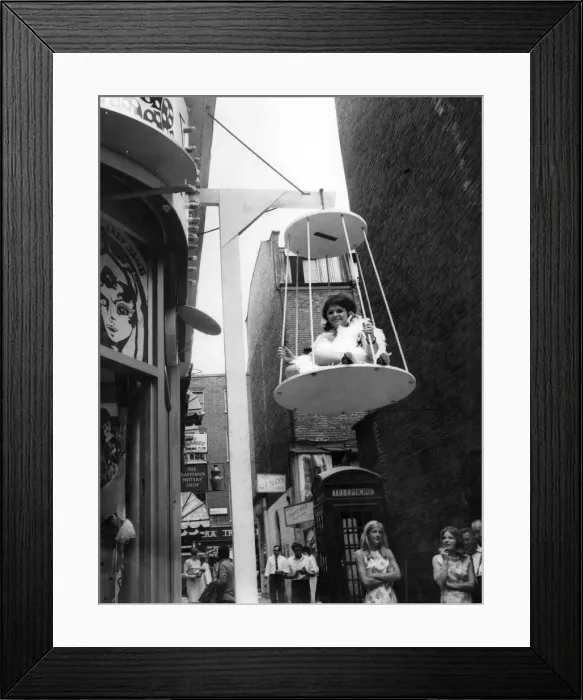 Framed Print : Sylvia Bryan in her birdcage outside the boutique. July 1967 P006383 Framed Print : Sylvia Bryan in her birdcage outside the boutique. July 1967 P006383