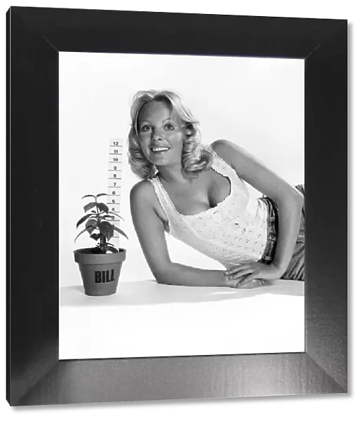 Unusual: Humour: Model Angela Jay and plant. March 1975 75-01424-010