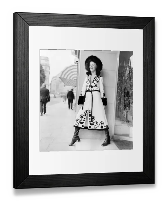 Framed Print : Paris fashions: Pictures taken at Louis Feraud. Model Christine in white wool Zipp front