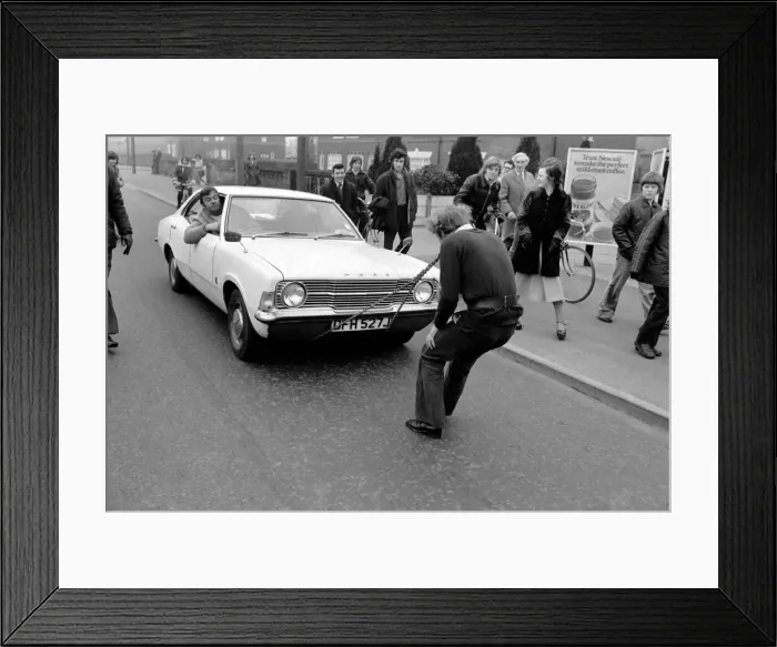 Framed Print : Strongman Reg Morris pulls car and passengers with his teeth. February 1975 75-00777-006 Framed Print : Strongman Reg Morris pulls car and passengers with his teeth. February 1975 75-00777-006