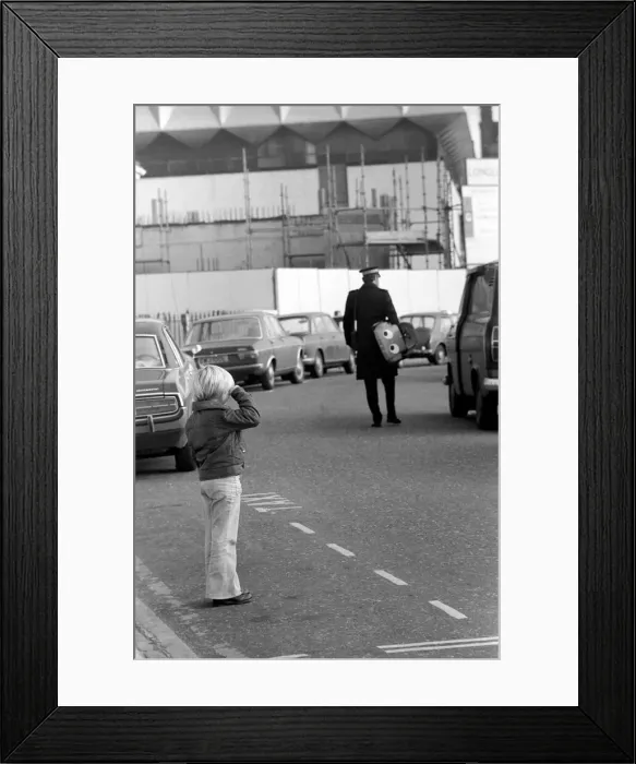 Framed Print : 1975 Brighton Toy Fair. Small boy cries as Traffic Warden confiscate toy pedal car for Framed Print : 1975 Brighton Toy Fair. Small boy cries as Traffic Warden confiscate toy pedal car for