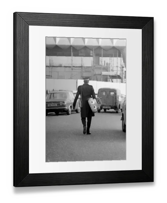 Framed Print : 1975 Brighton Toy Fair. Small boy cries as Traffic Warden confiscate toy pedal car for