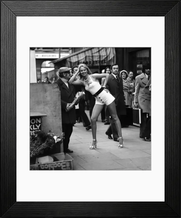 Framed Print : A London flower seller says it with flowers when he met model Christine Donna