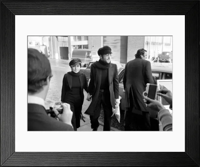 Framed Print : John Lennon and Yoko pictured on the roof of Black House in Holloway Road, with Michael X