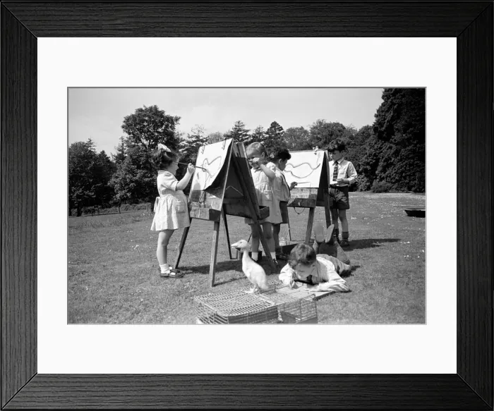 Framed Print : Children at Crarleigh L. C. C. Residential Nursery School look after their pet ducklings